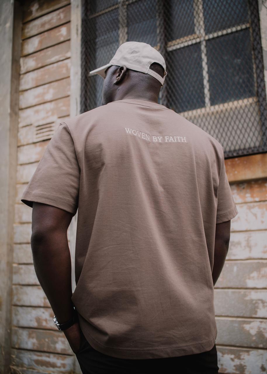 Woven by faith embroidered across the back